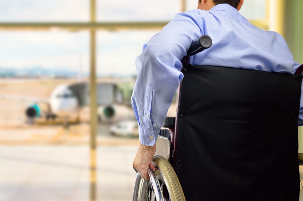 passenger sat in wheelchair at airport