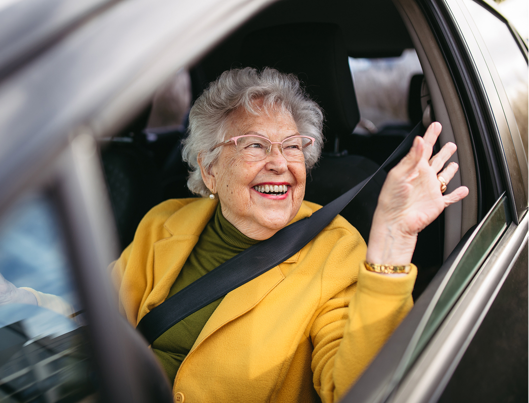 person in car in car park