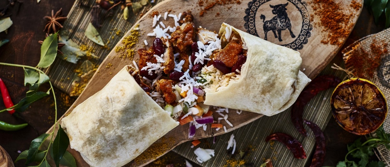 Wrapchic logo with image of food behind