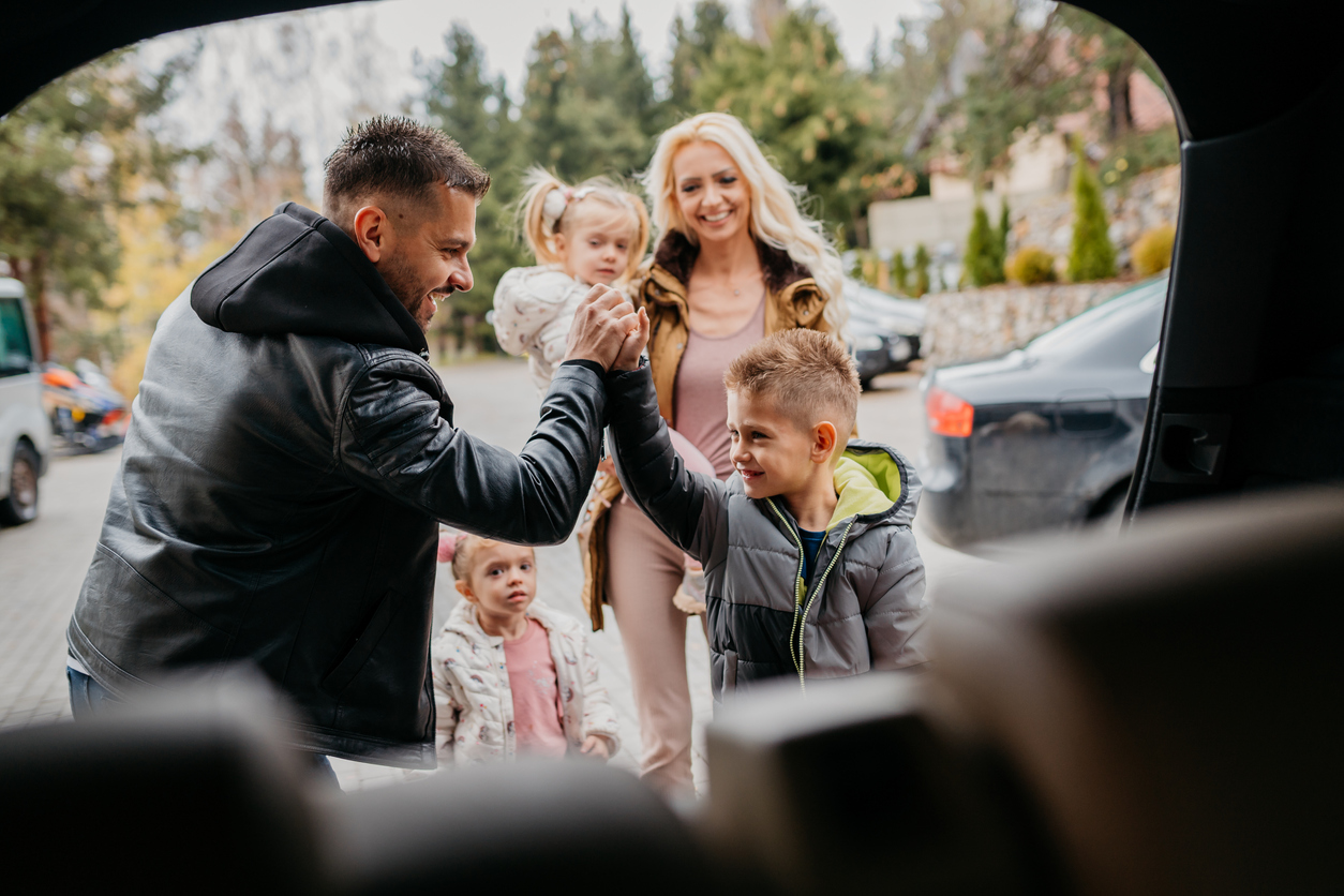 family with children in a car park