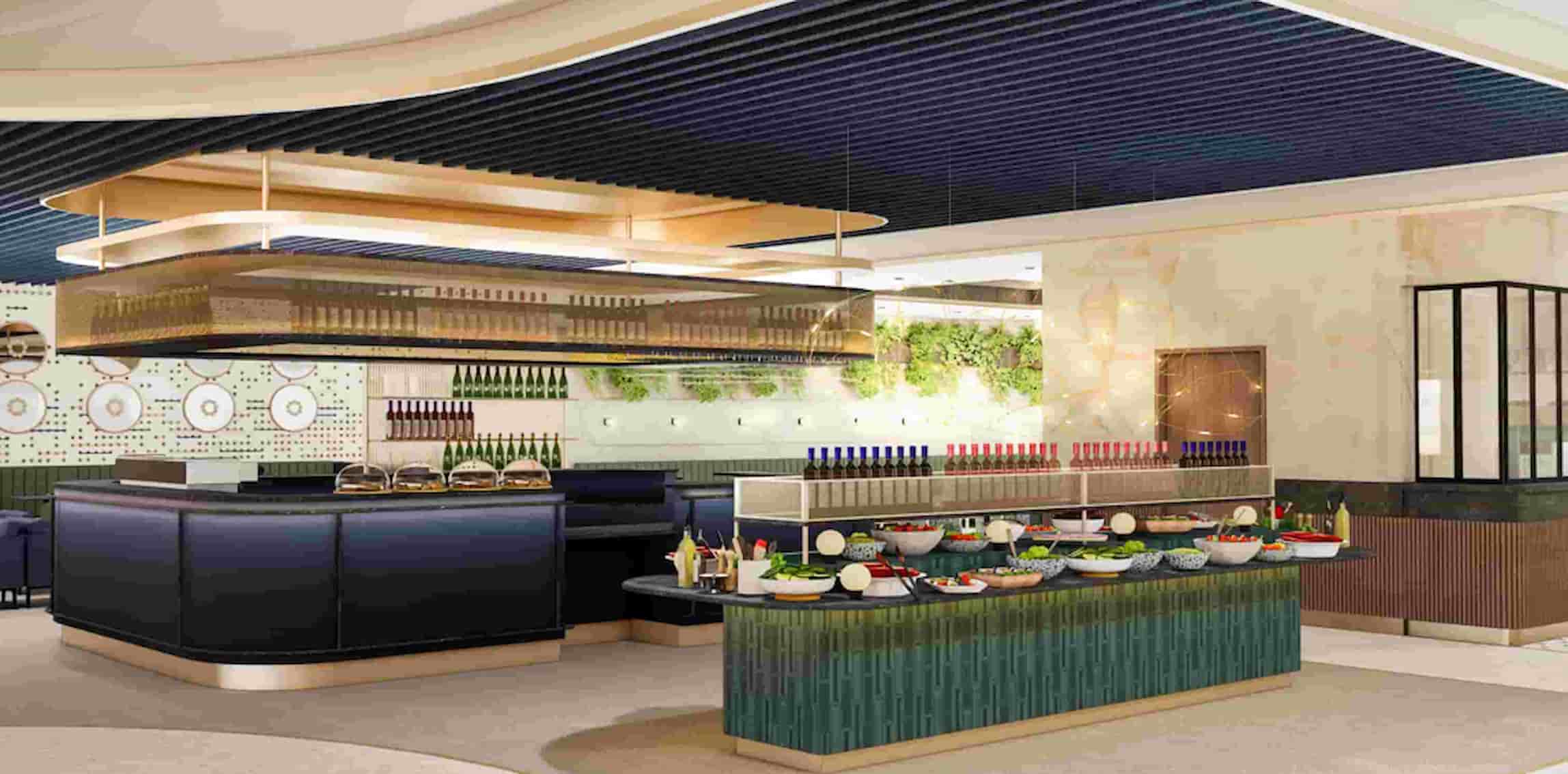 Modern buffet setup with a variety of dishes on display, surrounded by elegant decor and stylish lighting.