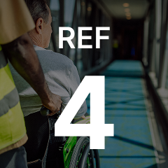 A person pushes another individual in a wheelchair down a brightly lit corridor, with large text "REF 4" overlaid.