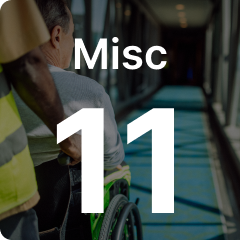 Person in a wheelchair assisted by another in a hallway, with large text "Misc 11" overlaying the image.