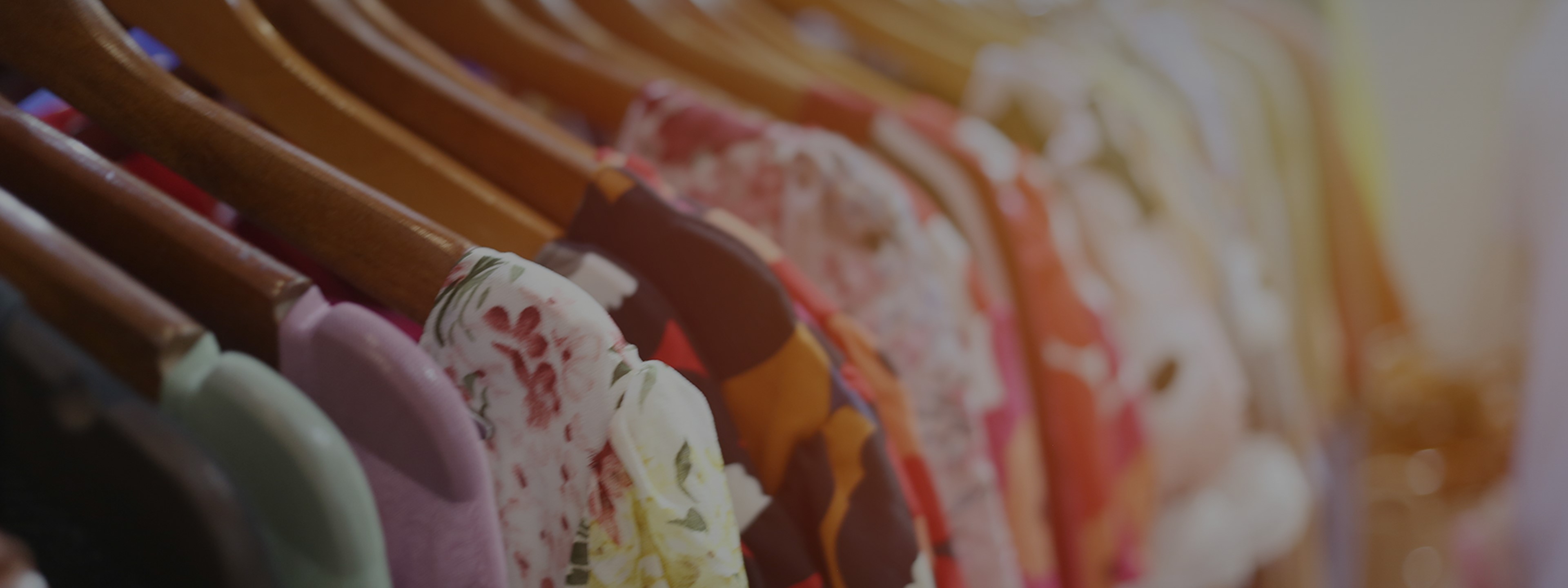 Colourful clothes on rail