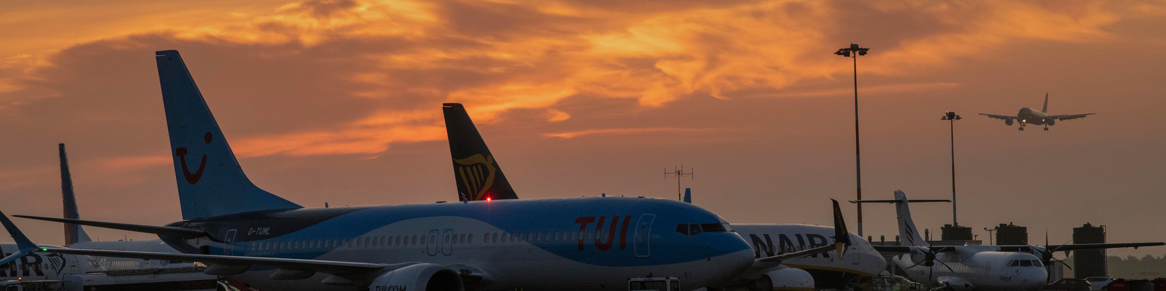 Planes parked up with sunset in background