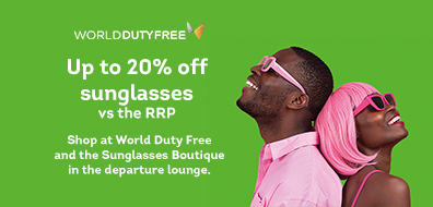 Two people wearing matching pink sunglasses and shirts, smiling upwards. Text reads: "Up to 20% off sunglasses vs the RRP" at World Duty Free.