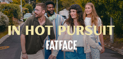 Four people walking down a street, laughing and holding hands. Overlaid text reads "In Hot Pursuit" and "FatFace."