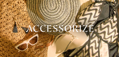 Woven hat, sunglasses, sandals, and bags on display with "Accessorize" text; summer accessory theme.