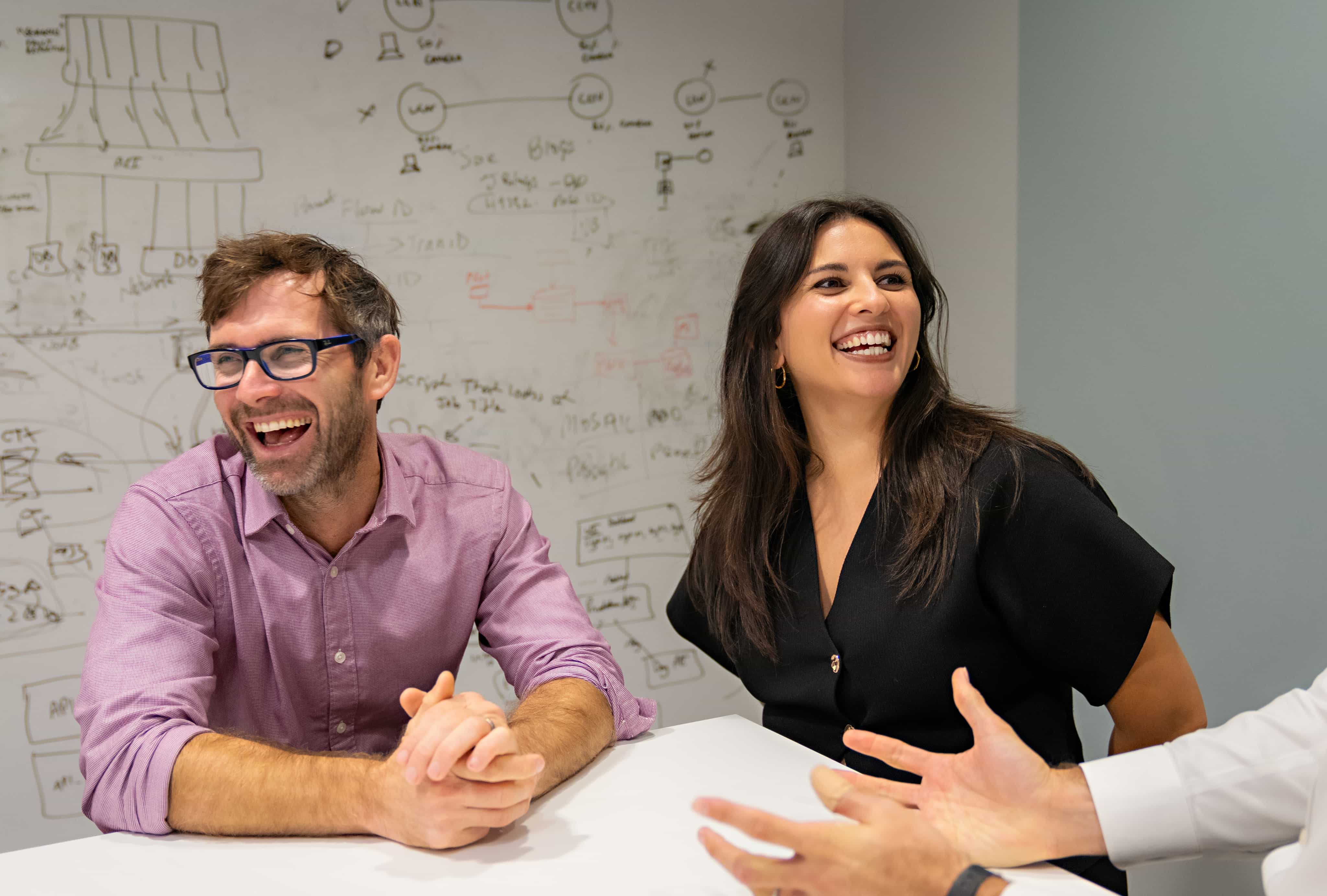 Two people laughing